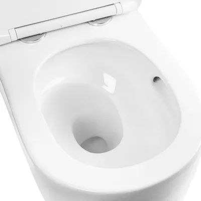 A close-up view of the interior of a white toilet bowl.