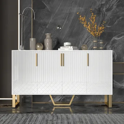 A white sideboard with gold accents is displayed in a modern room with a dark marble wall and a striped rug.