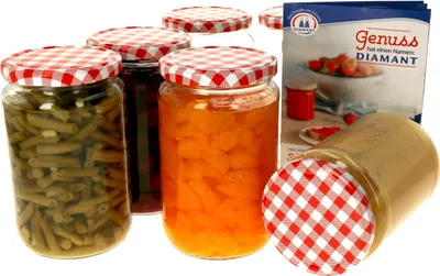 Several jars of preserved food with red and white checkered lids are arranged on a white background, with a product box in the background.