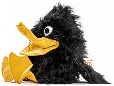 A plush toy raven sitting on a white background.