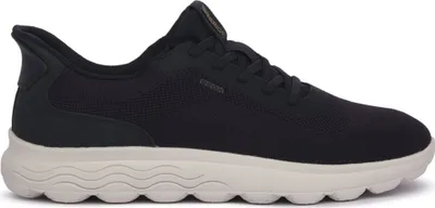 A side view of a navy blue Geox sneaker with a beige sole.