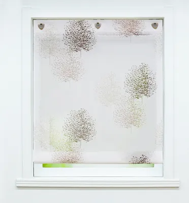 A roller blind with a tree pattern is shown hanging in a white window frame.