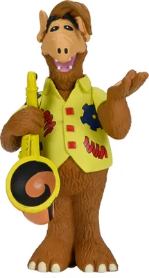 A studio shot of an Alf figurine holding a saxophone.