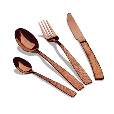 A set of four rose gold cutlery items arranged diagonally on a white background.