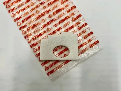 A Stihl branded plastic bag with a Stihl air filter on top.