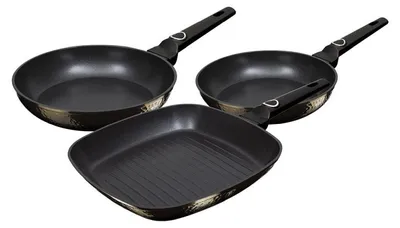 Three frying pans of different shapes and sizes on a white background.