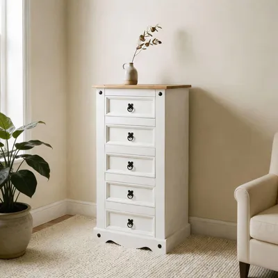 A white chest of drawers with a wooden top, placed in a room with a plant and a chair.
