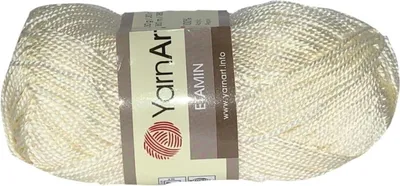A ball of cream-colored yarn is shown against a white background.