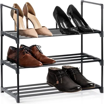 A three-tier black metal shoe rack with various shoes on each tier.