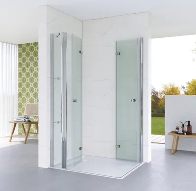 A modern bathroom with a corner shower enclosure.