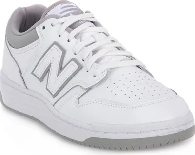 A white New Balance sneaker with gray accents.