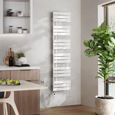 A modern kitchen or dining area with a white towel warmer, a wooden cabinet, a table with fruit, and a large potted plant.