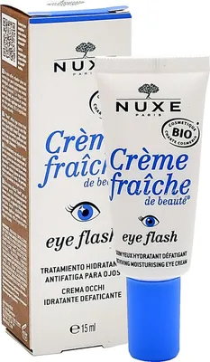 A product shot of a Nuxe eye cream tube and its box.
