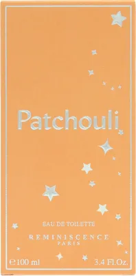 The image shows the front of an orange perfume box with silver text and star decorations.