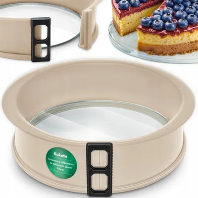A baking pan with a glass bottom and a slice of cake with blueberries on top.