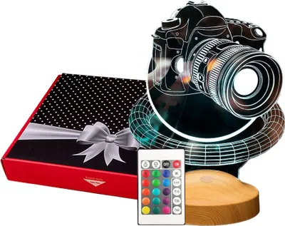 A gift box and a 3D LED lamp shaped like a camera are displayed together on a white background.