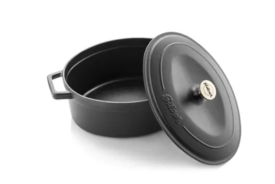 A black oval cast iron pot with its lid slightly ajar, displayed on a white background.