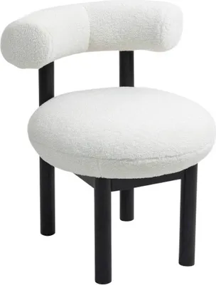 A modern bouclé accent chair with black legs, isolated on a white background.