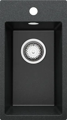 A top-down view of a black granite kitchen sink with a drain assembly visible.