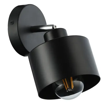A black, modern wall lamp with a visible Edison-style bulb.