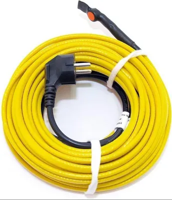 A coiled yellow heating cable with a black plug on a white background.