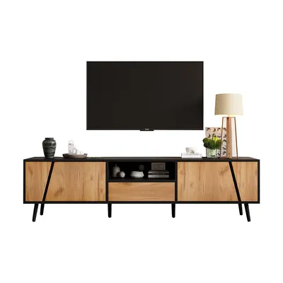 A TV stand with a television on top, and decorative items on the stand.