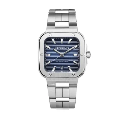 A silver watch with a blue dial is shown against a white background.