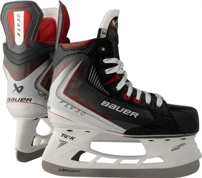A pair of black and white Bauer hockey skates are shown from a side-angle.
