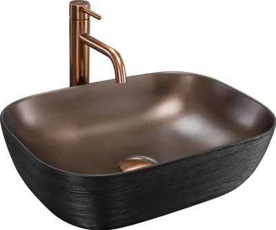 A modern vessel sink with a copper faucet, set against a white background.