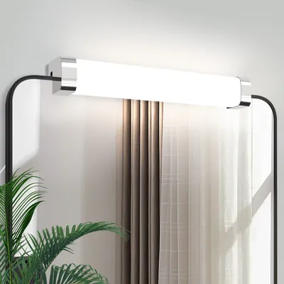 A modern bathroom vanity light fixture mounted above a mirror, with sheer curtains in the background.