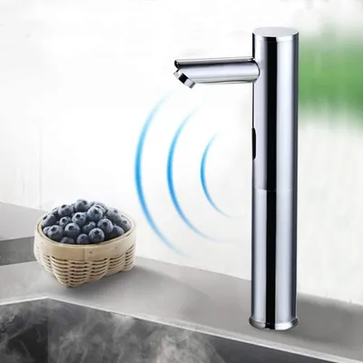 A chrome-finished automatic faucet with sensor technology is shown next to a basket of blueberries, with steam rising from below.