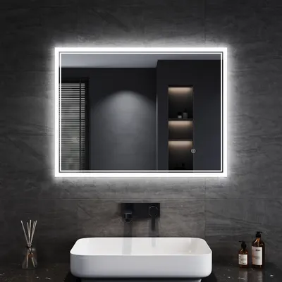 A modern bathroom with a sink and a large LED mirror.
