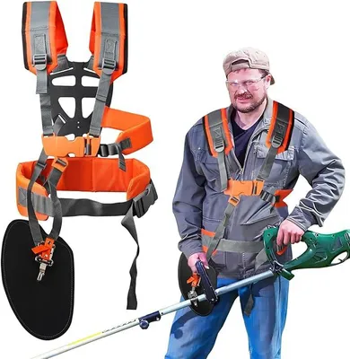 A man wearing a harness and holding a string trimmer.
