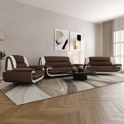 A living room scene featuring a sofa set, coffee table, and artwork on the wall.