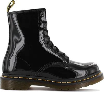 A black patent leather Dr. Martens boot shown from the side.