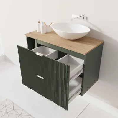 A modern bathroom vanity with a sink and faucet.