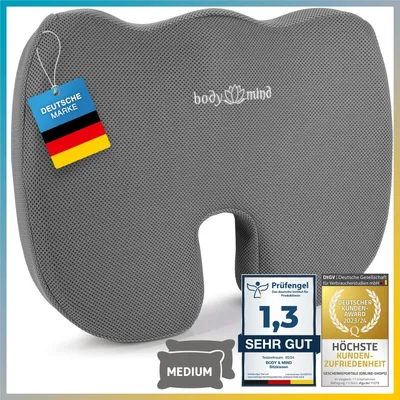 A gray orthopedic seat cushion with various certifications and labels.
