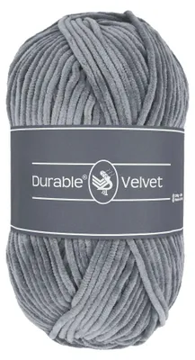 A ball of gray velvet yarn with a dark gray label.