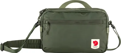 A green Fjällräven crossbody bag is shown against a white background.