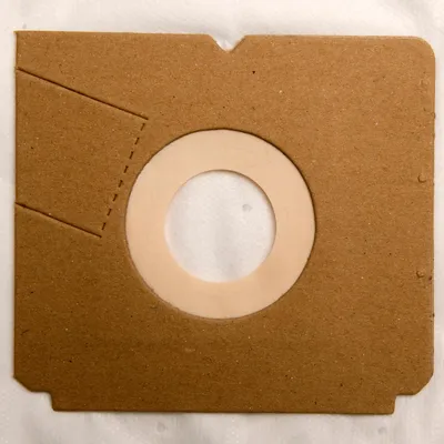 A close-up view of a vacuum cleaner bag's opening.