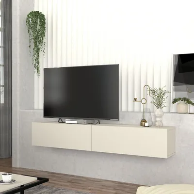 A modern living room setting with a wall-mounted TV lowboard.