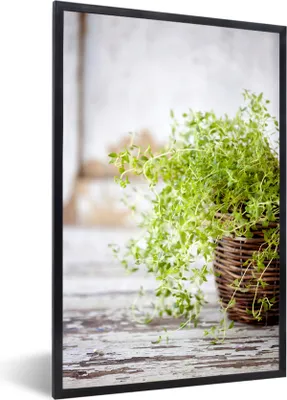 Produktbild von MuchoWow® MuchoWow® Gerahmtes Poster Weidenkorb mit hellgrünen Thymianpflanzen auf einem rustikalen Tisch 40x60 cm - Poster mit zchwarzem Bilderrahmen - Papierdruck - Wandbilder