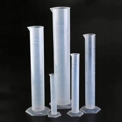 A group of graduated cylinders of various sizes arranged on a black background.