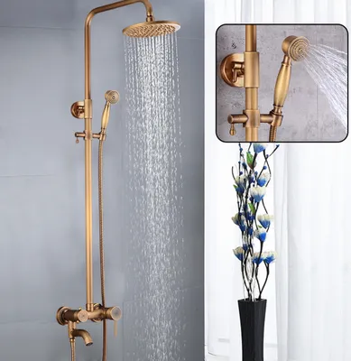 A retro-style shower system with a showerhead and handheld showerhead, with water flowing from both.