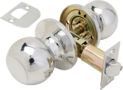 A disassembled door knob set with its latch and strike plate, shown on a white background.