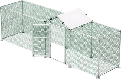 A top-down view of an empty outdoor chicken coop or run.