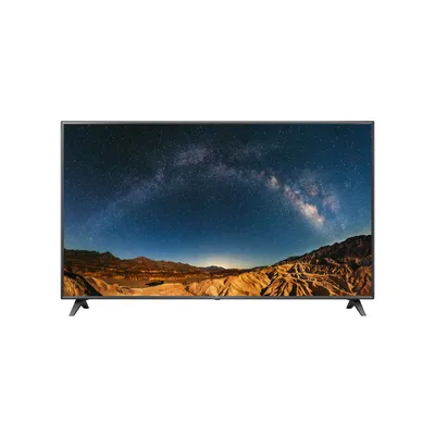 A flat-screen television displaying a landscape image of the Milky Way over a desert.