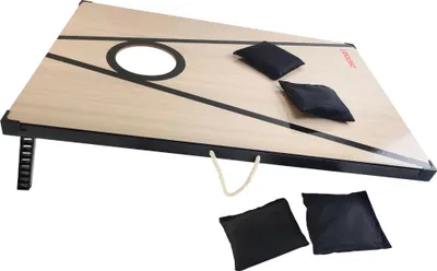 A cornhole board with bean bags on a white background.