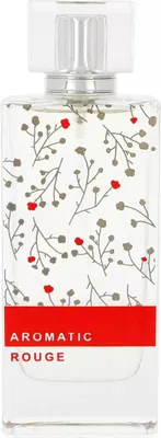 A perfume bottle with a floral pattern and red band with text.