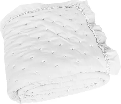A folded white blanket with a ruffled edge and a subtle floral pattern.